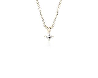 A thirteen-thousand-twelfth lab-grown diamond princess cut solitaire pendant set in 14k yellow gold.