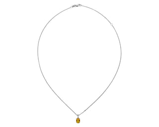 An oval pendant set in 14k white gold with citrine and diamonds (8x6mm)