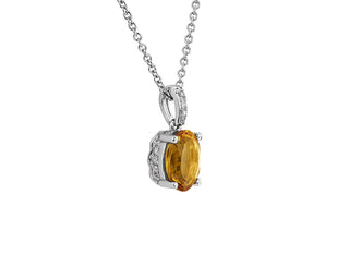 An oval pendant set in 14k white gold with citrine and diamonds (8x6mm)