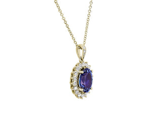 14k yellow gold oval tanzanite sunburst pendant (10x8mm)