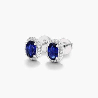 18K White Gold Oval Halo Sapphire And Diamond Earrings (6.0x4.0mm)