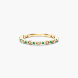 Emerald and diamond ring set in 14k yellow gold with alternating marquise shape milgrain bezel.