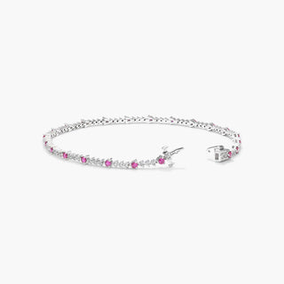 Tennis bracelet with perpetual diamond and ruby set in 14K white gold.