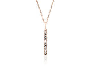 Tiny 14k rose gold vertical bar pendant set with diamonds