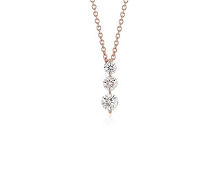 18k rose gold pendant with a three-stone drop diamond (1 carat total weight)