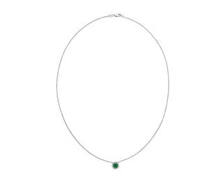 A 14k white gold pendant with an emerald and diamond halo (5mm)