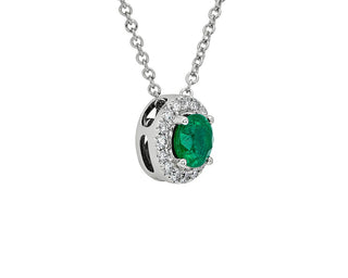 A 14k white gold pendant with an emerald and diamond halo (5mm)