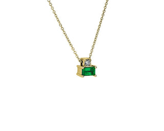 A 14k yellow gold solitaire pendant set with emerald and diamonds.