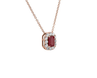 A 14k rose gold pendant with an emerald cut ruby and diamond halo (6x4mm)