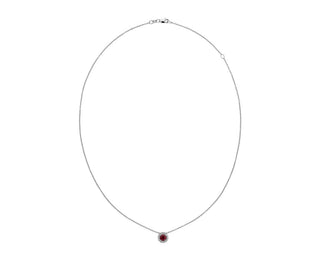 A 14k white gold pendant with a ruby and diamond halo (5mm)