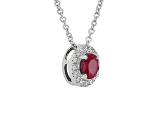 A 14k white gold pendant with a ruby and diamond halo (5mm)