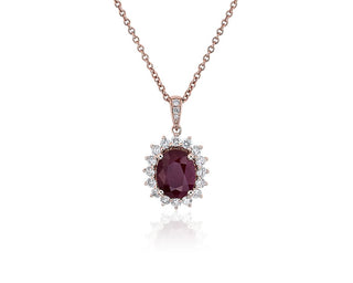 Sunburst Halo Pendant in 14k Rose Gold with an oval ruby and diamond (9x7mm)