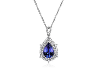 Double halo pendant in 14k white gold shaped like a pear set with tanzanite and diamonds