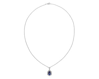 Double halo pendant in 14k white gold shaped like a pear set with tanzanite and diamonds