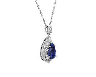 Double halo pendant in 14k white gold shaped like a pear set with tanzanite and diamonds