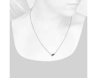 Two-stone pendant set in 14k white gold with tanzanite and pink tourmaline.