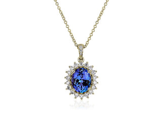 14k yellow gold oval tanzanite sunburst pendant (10x8mm)