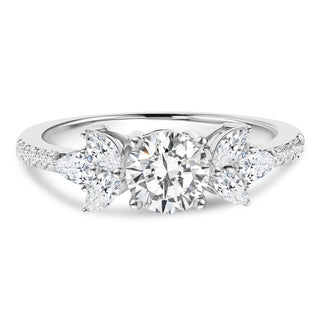 Three-stone engagement ring with side diamonds