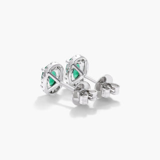 18K White Gold Oval Halo Emerald And Diamond Earrings (6.0x4.0mm)