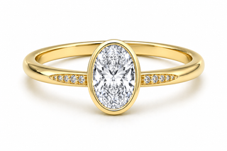 Tapered Pavé Band Bezel Setting on an Oval Cut Engagement Ring